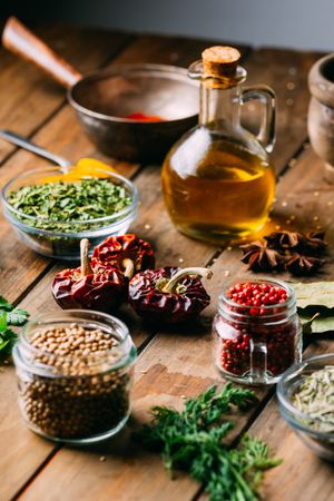 Spices and oil on table