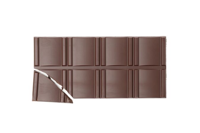 Tasty chocolate bar isolated on studio background