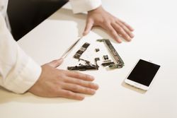 Young man repairing modern device