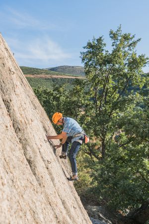 Free climber climbing in nature