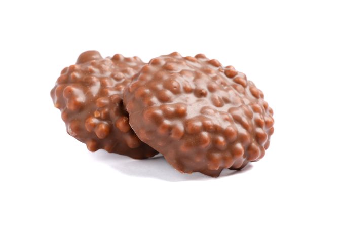 Chocolate cookies with caramel filling isolated on blank background