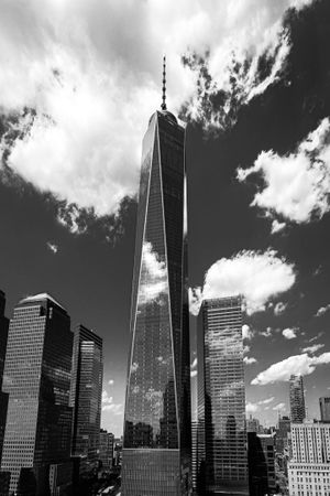 Grayscale photo of The Freedom Tower skyscraper in NYC skyline