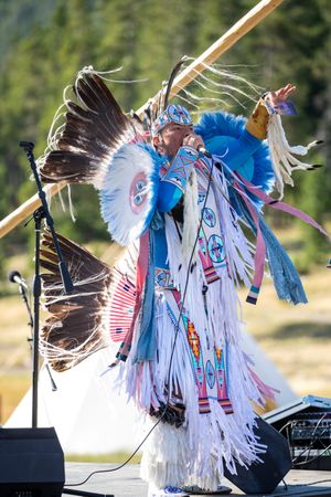 Montana, United States - August 17, 2022: Native man in full regalia performing, vertical