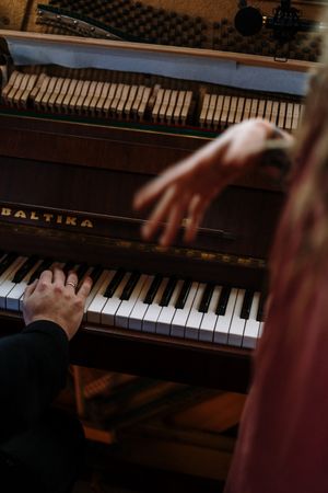 Cropped image of hands playing the piano