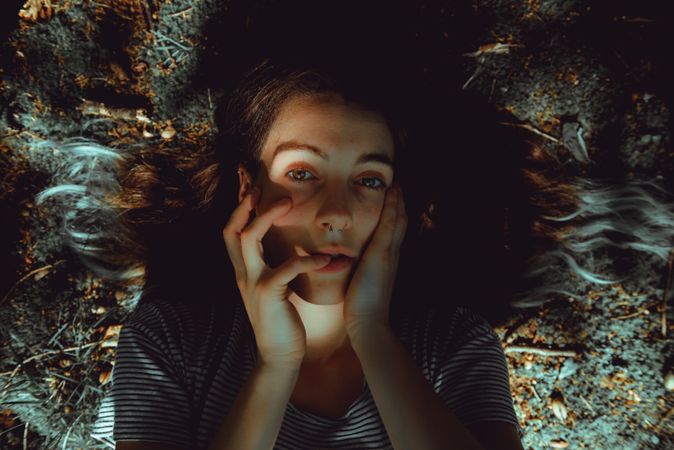 Woman lying on ground