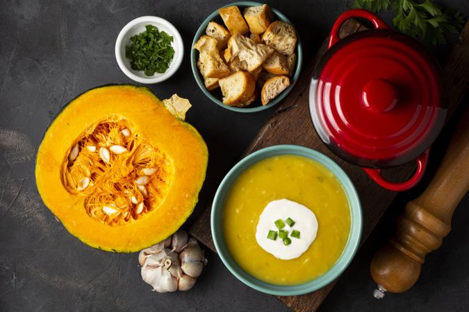 Bowl with pumpkin soup on the table.
