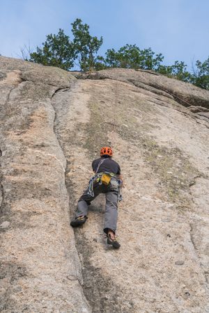 Man climbing a rock