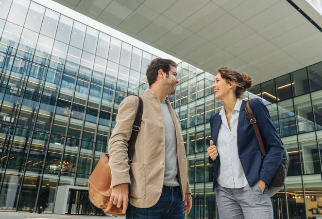 Positive businesspeople walking from work together