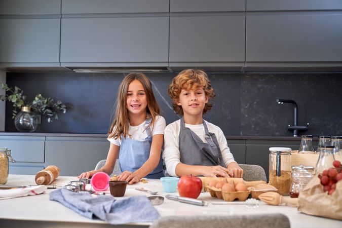 Content children preparing dough for cookies