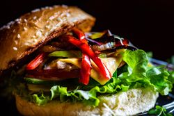 Hamburger with red peppers and cheese