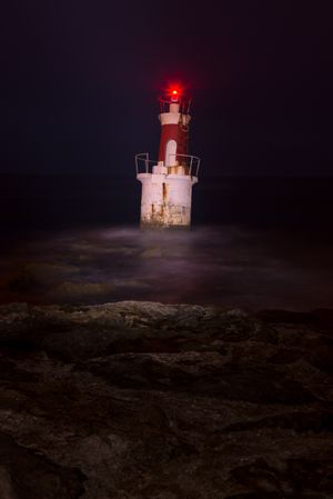 Lighthouse on rocky coastline