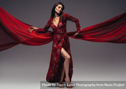 Fashion woman in fluttering red long dress 5r9kBp