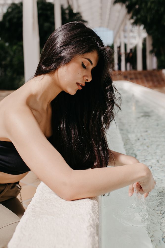 Sensual female relaxing in garden