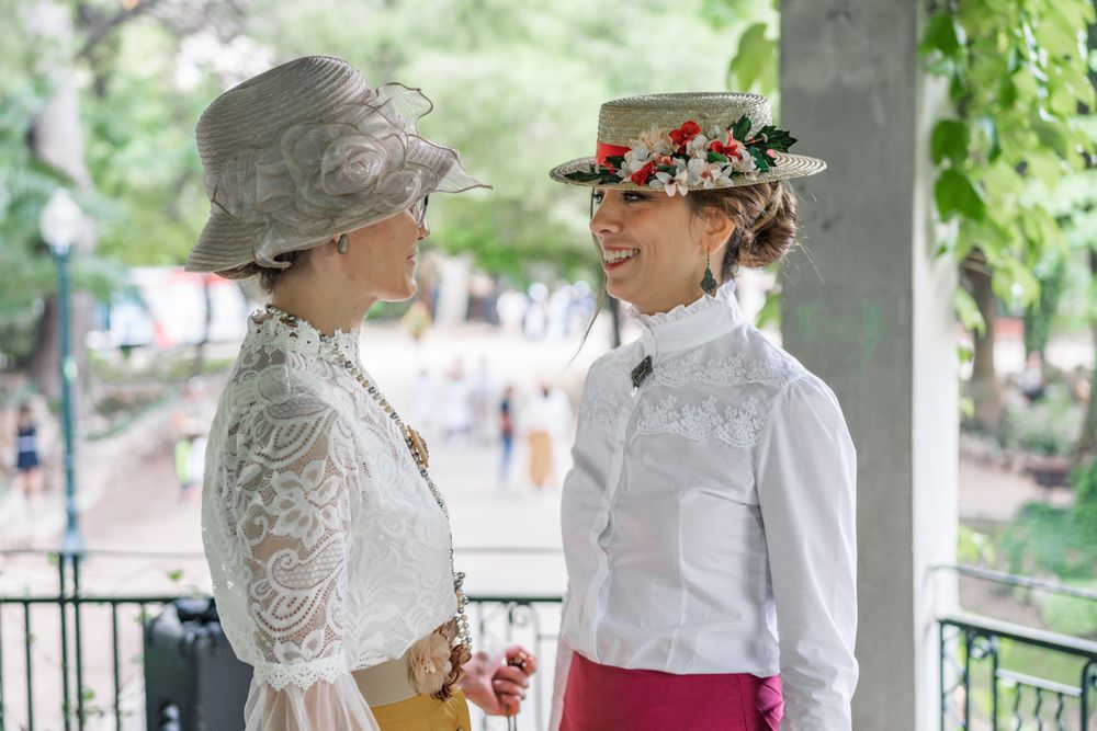 Vintage female friends speaking in garden
