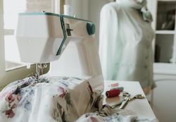 Dummy with blouse near sewing machine
