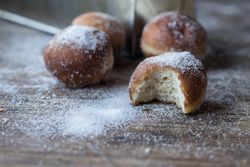 Baked cakes in craft paper on table