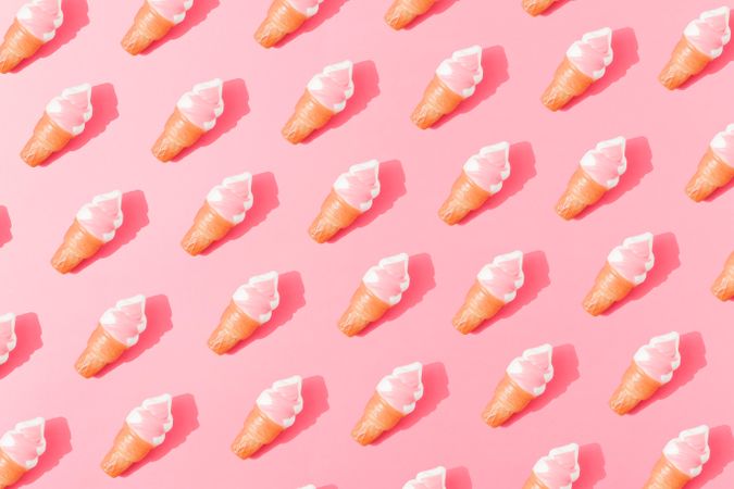 Flat lay of ice cream pattern on pastel pink background