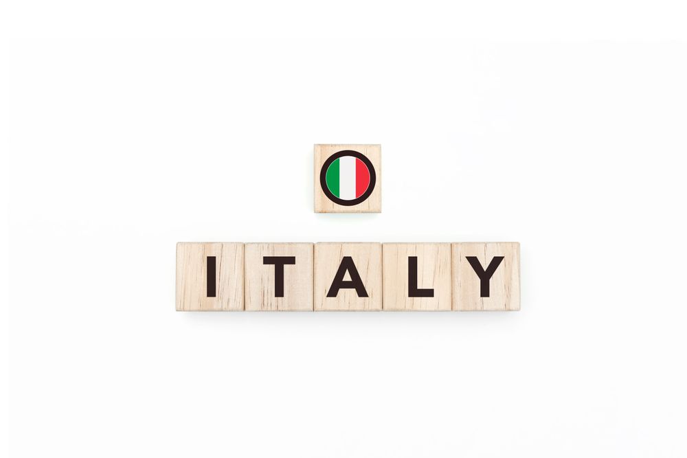 Wooden blocks bearing the name and flag of Italy.