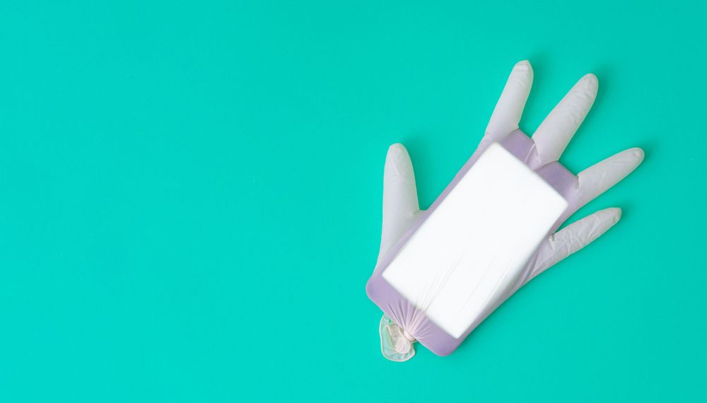Surgical latex glove and mobile phone