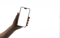 Hand holding smartphone on light background
