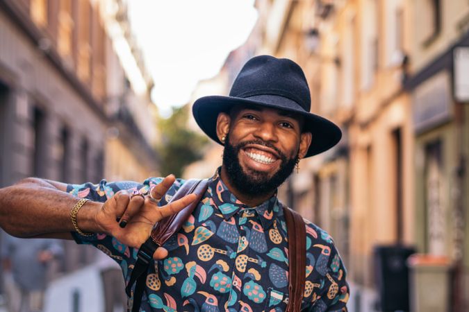 Stylish Black man having fun on the city street