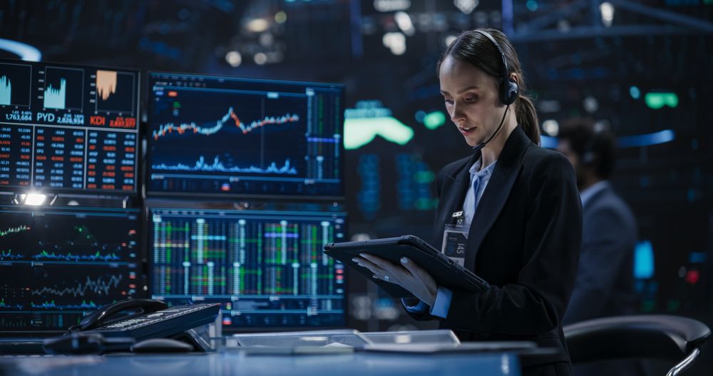 Portrait of a Female Trader Working in an International Stock Exchange Hall