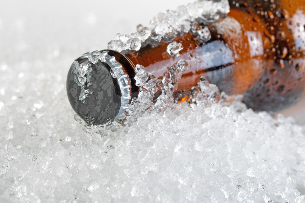 Ice cold beer bottle neck and cap
