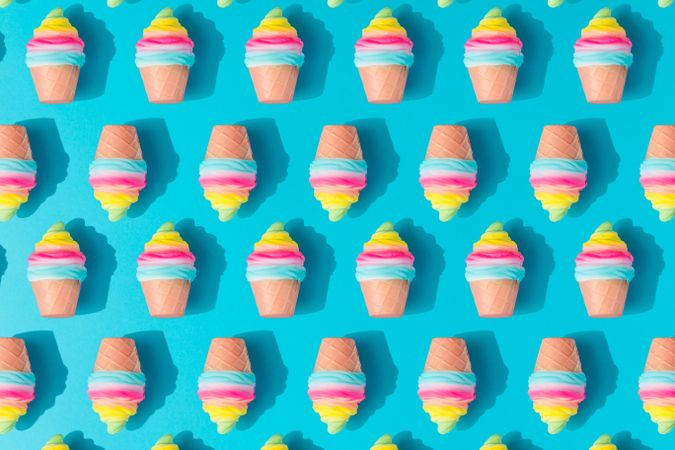 Pattern of colorful rows of ice cream on bright blue background