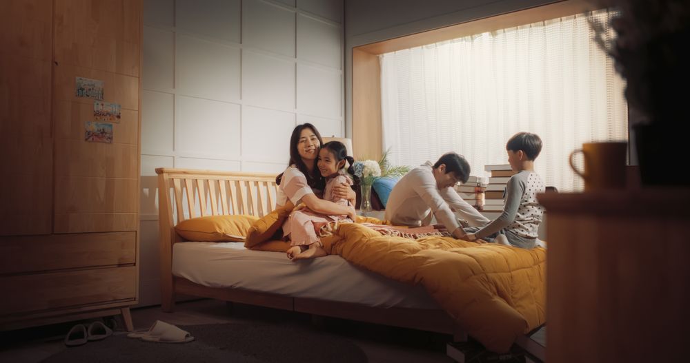 Active and Playful Children Waking Their Parents Up to Face a New Day.