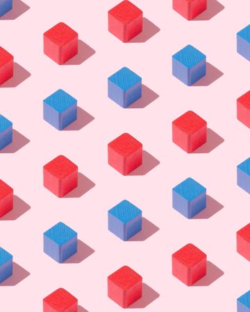 Blue and red cubes on pink background