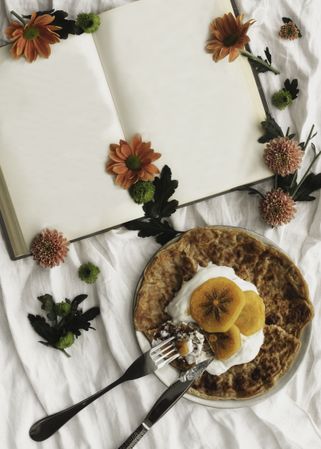 Crepes with cream and persimmon