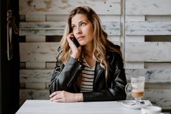 Woman using smartphone at table