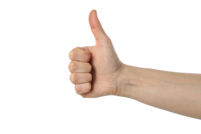 Female hand thumb up, isolated on plain background