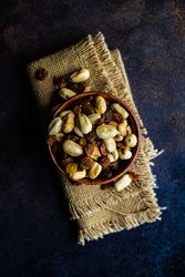 Top view of healthy nuts on dark table