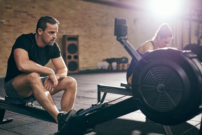 Tired male catching his breath after intense row exercise