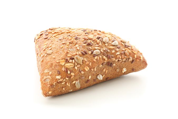 Triangular bun isolated on plain background. Bakery products