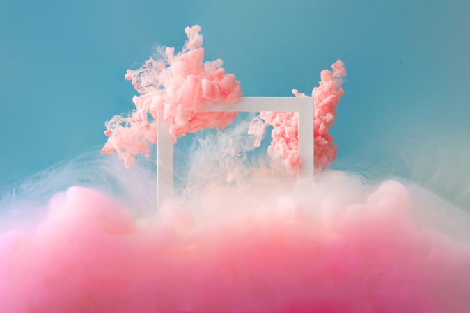 Cloud-like pink color paint with  light frame on blue background
