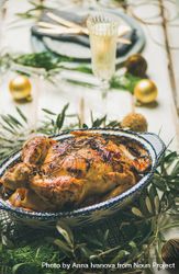 Roast chicken with festive decorations and crystal flute of champagne 47kvO4