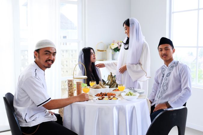 Celebrate Eid al Fitr or Hari Raya, Eating and Talking Together.