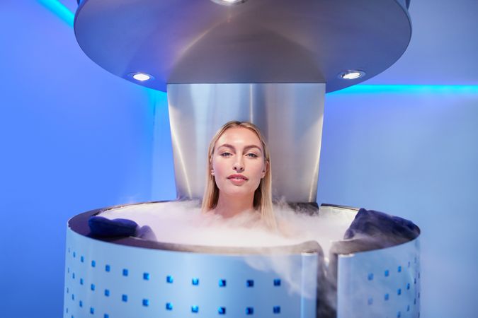 Blonde woman in cryotherapy chamber