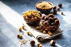 Bowls of blanched and unblanched hazelnuts