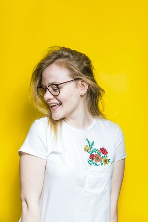 Blonde woman posing in wall
