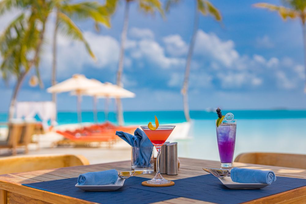 Landscape shot of cocktails on the beach