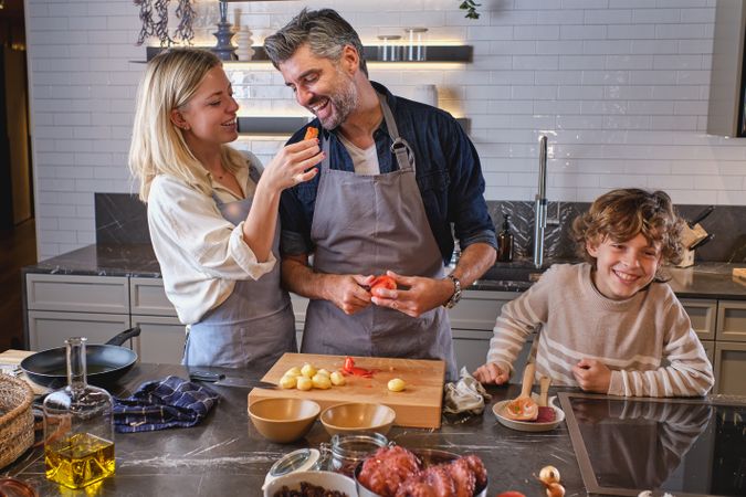 Content family cooking dinner together