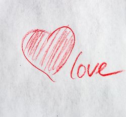 Valentine Day holiday card concept with red heart and love drawn on paper