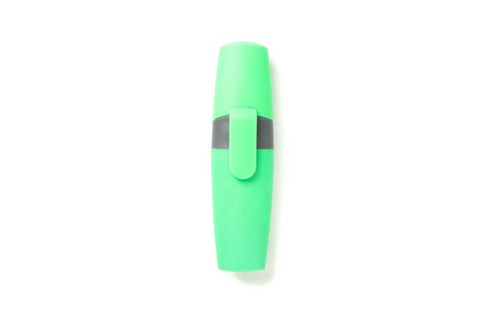 Color office highlighter isolated on plain background