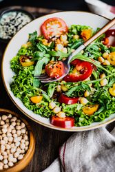 Close up of organic vegetable salad with garbanzo beans and tomatoes