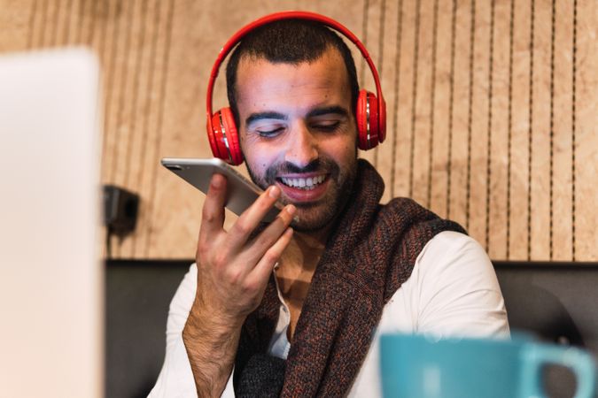 Male freelancer sending voice message