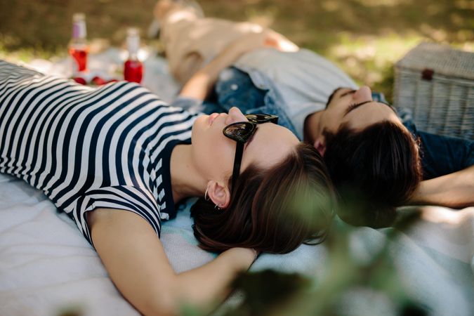 Couple relaxing at a park during picnic