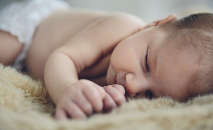 Baby sleeping on a blanket